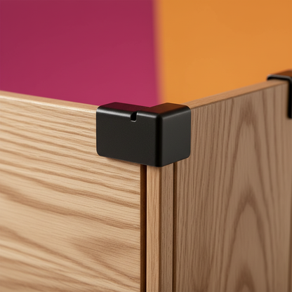Close-up of wood-grain panel edges and black protective corner connectors