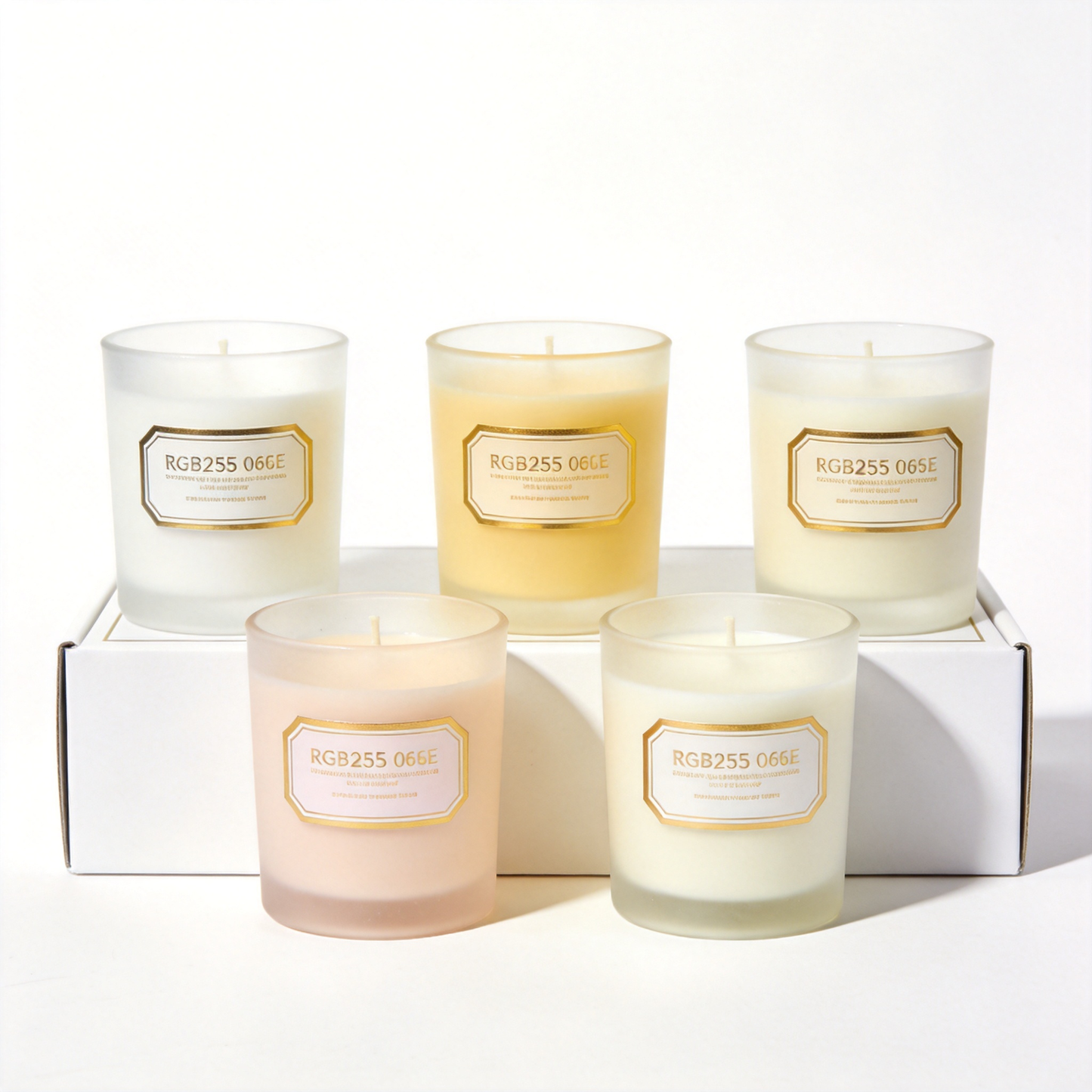 Five frosted glass candles arranged in a presentation box