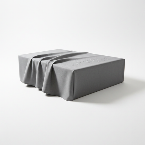 Gray water-resistant fabric surface cover neatly folded and draped on a pure white background